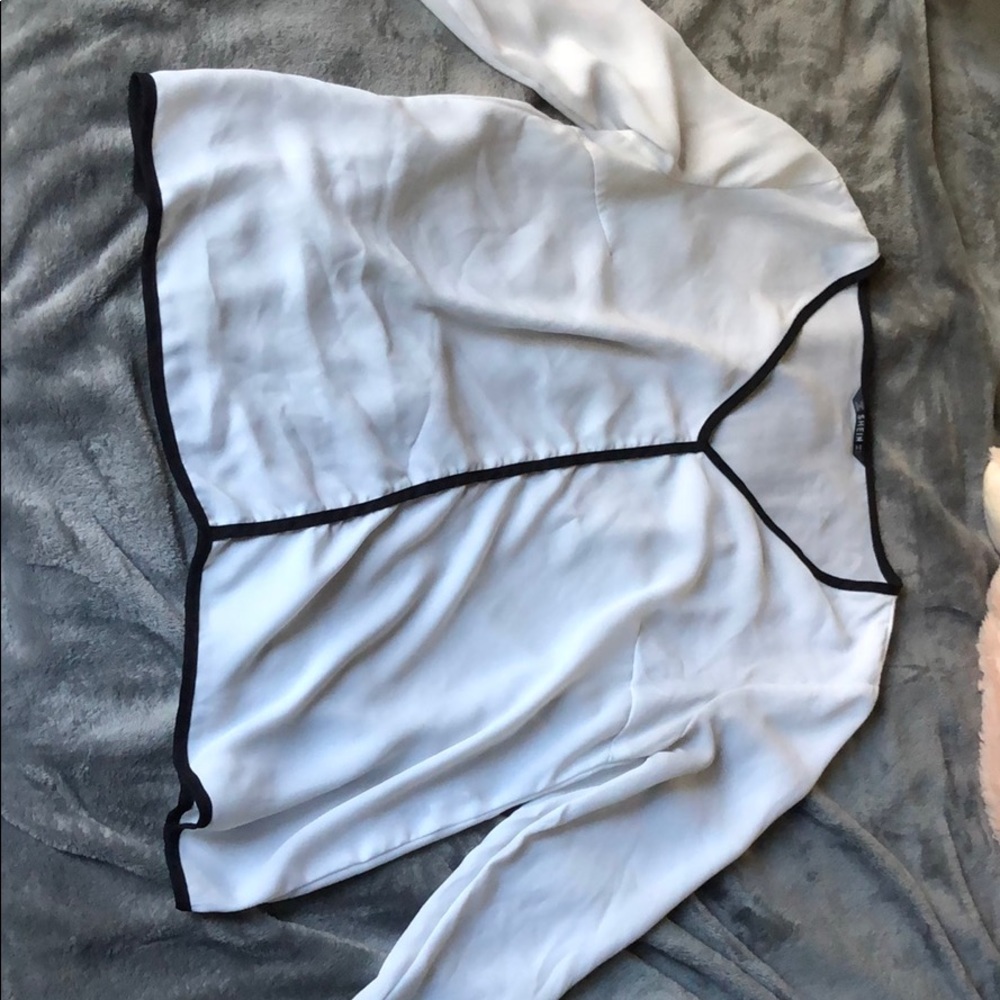 White or pink long sleeve with black accents